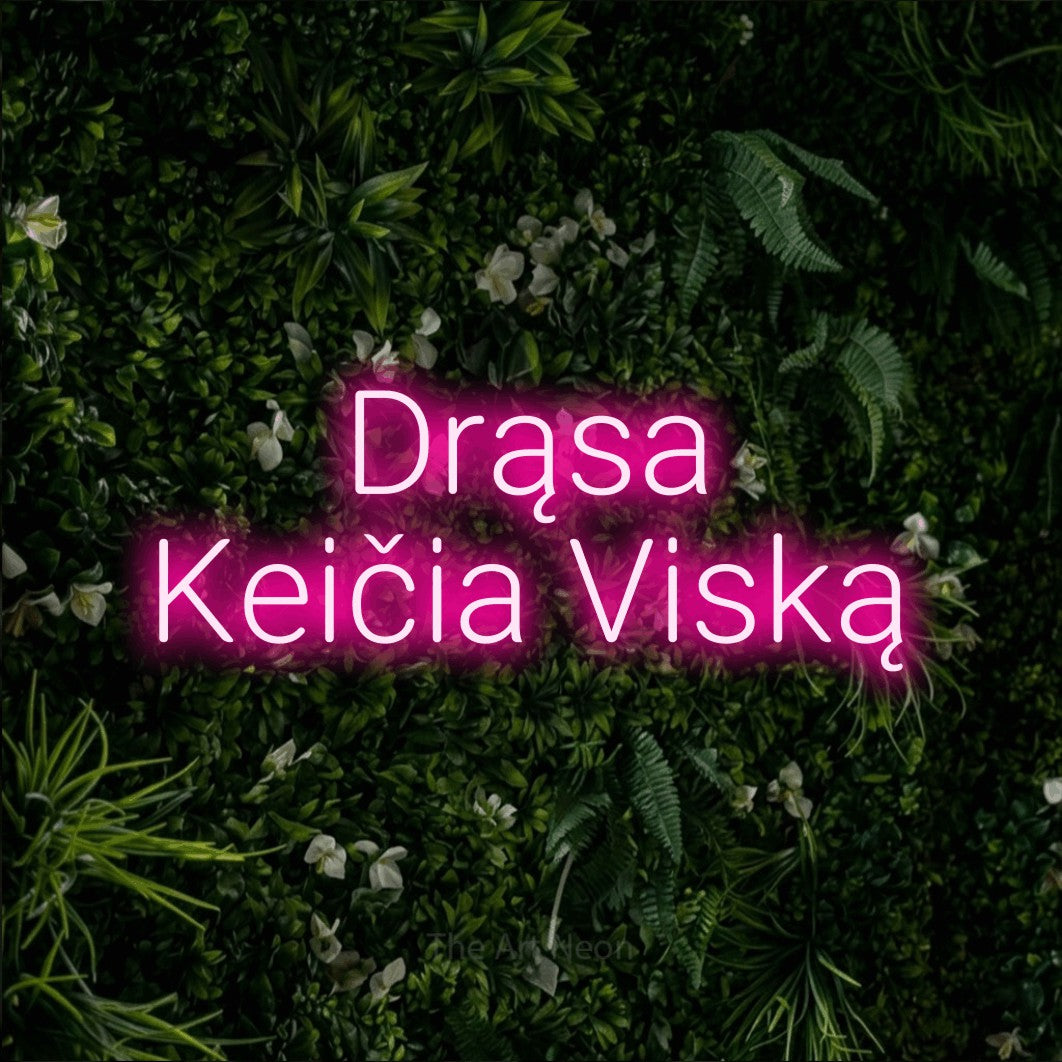 LED neon sign reading “Drąsa Keičia Viską”, arranged in two lines.