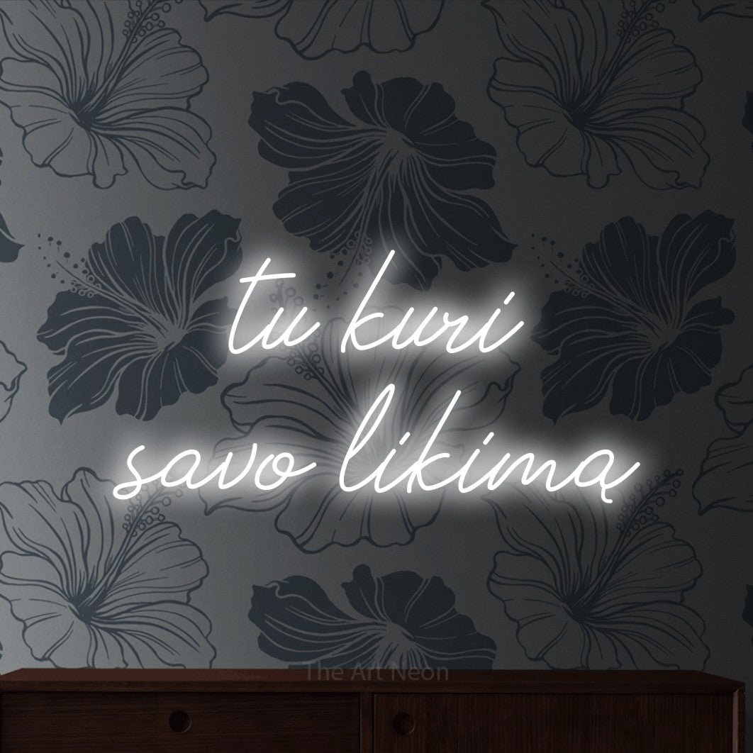 LED neon sign reading “tu kuri savo likimą”, arranged in two lines.