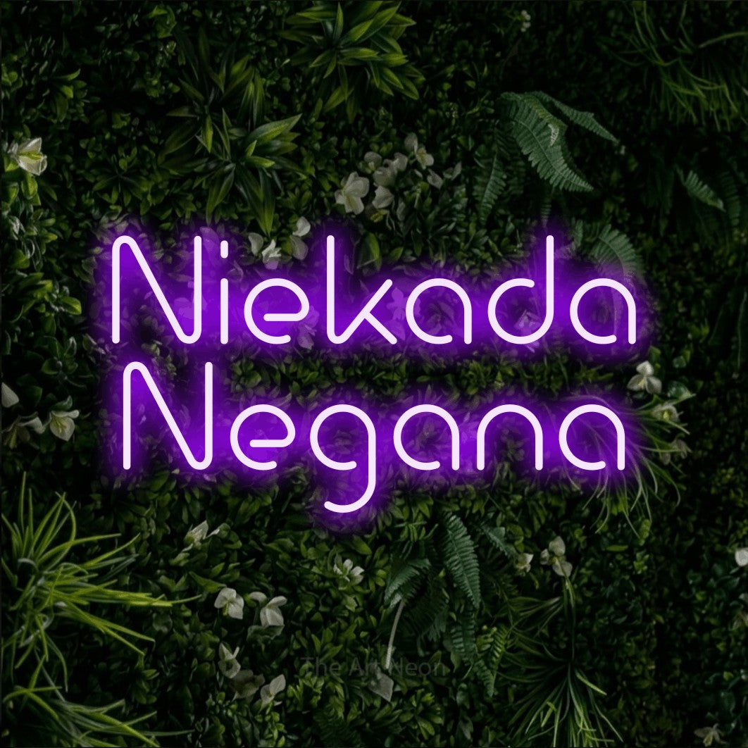 LED neon sign reading “Niekada Negana”, arranged in two lines.