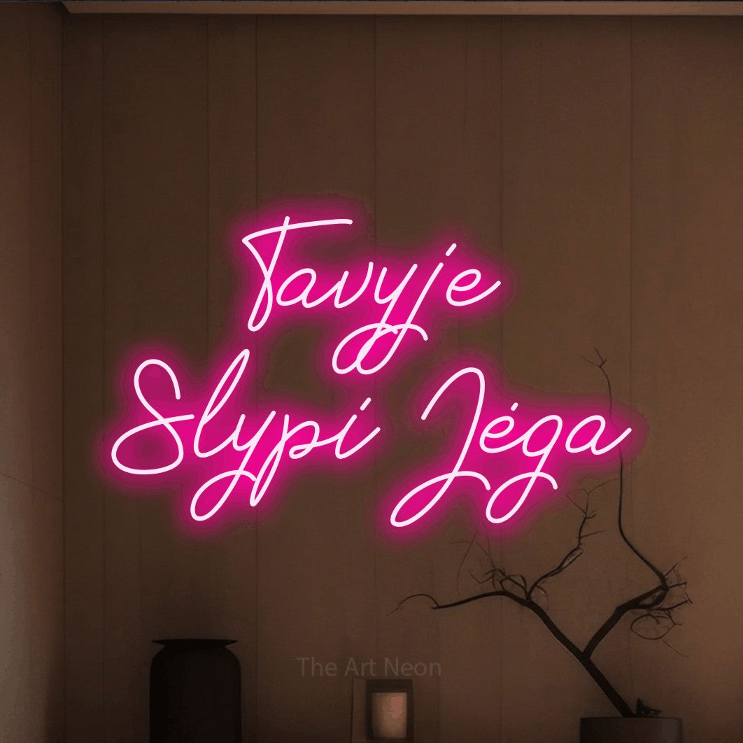 LED neon sign reading “Tavyje Slypi Jėga”, arranged in two lines.