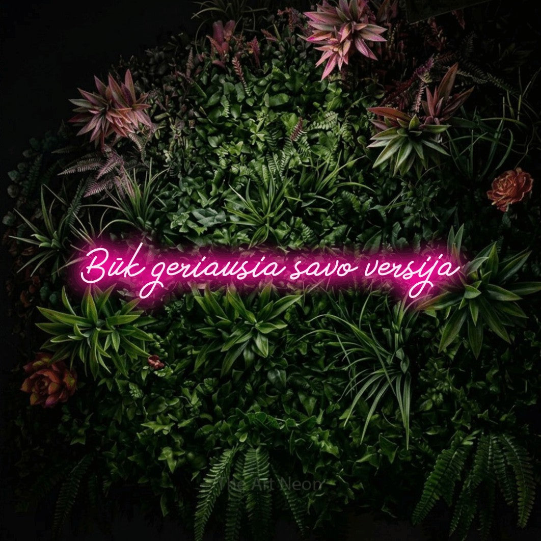 LED neon sign reading “Būk geriausia savo versija”, arranged in a single line.