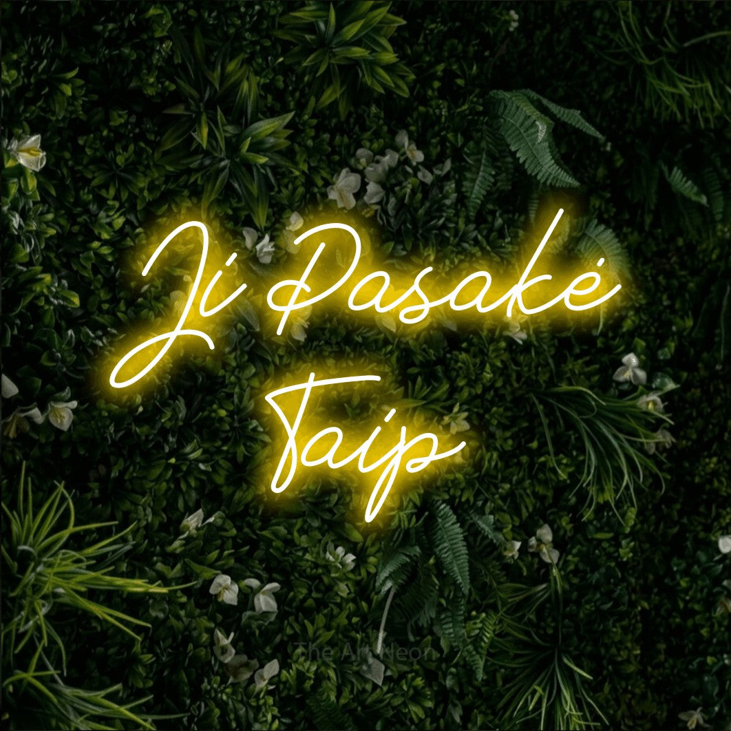 LED neon sign reading “Ji Pasakė Taip”, arranged in two lines.
