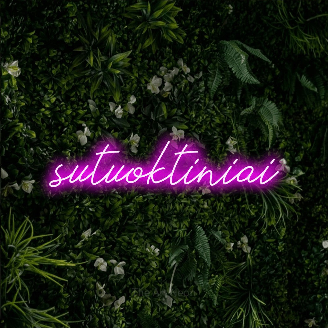 LED neon sign reading “sutuoktiniai”, arranged in a single line.