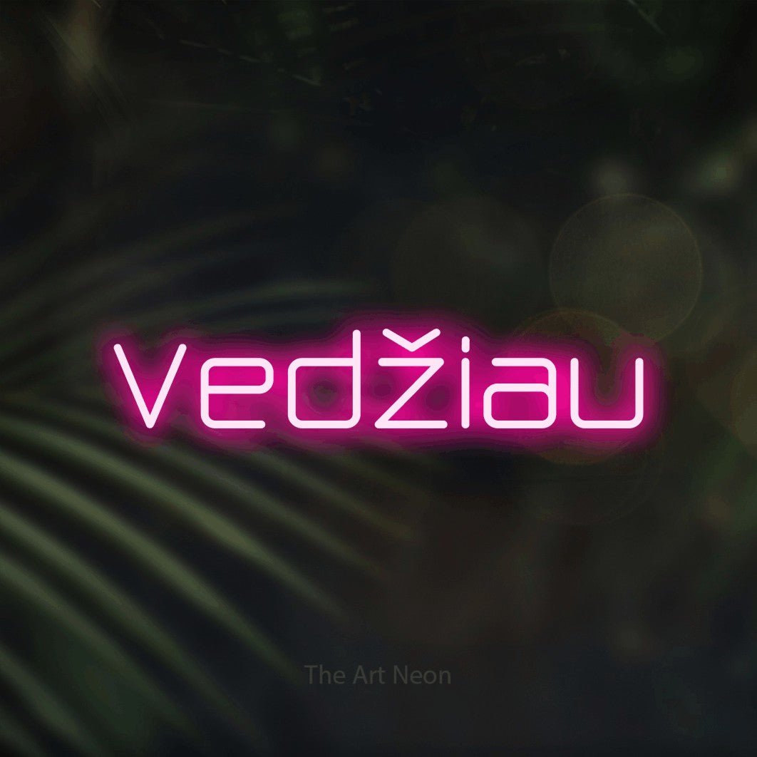 LED neon sign reading “Vedžiau”, arranged in a single line.