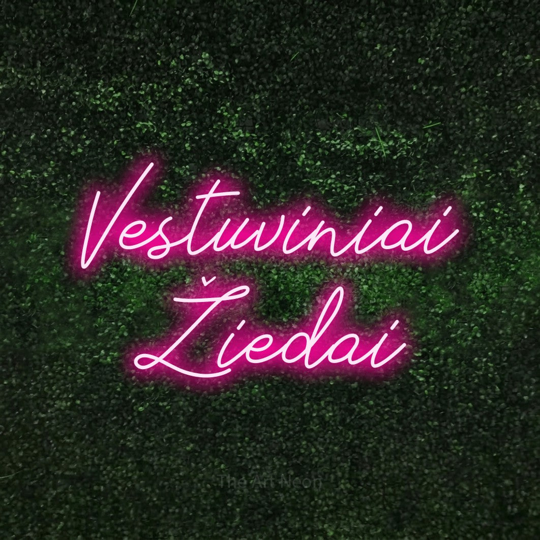 LED neon sign reading “Vestuviniai Žiedai”, arranged in two lines.