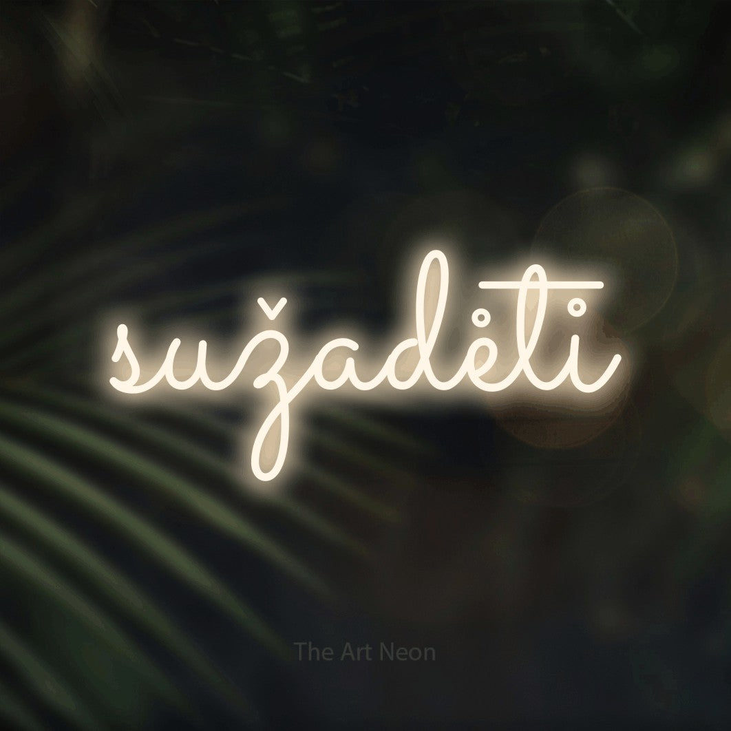 LED neon sign reading “sužadėti”, arranged in a single line.