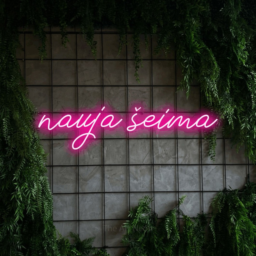 LED neon sign reading “nauja šeima”, arranged in a single line.