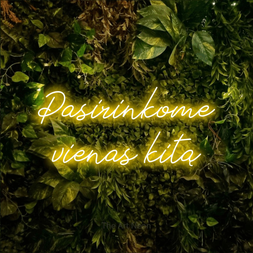 LED neon sign reading “Pasirinkome vienas kitą”, arranged in two lines.