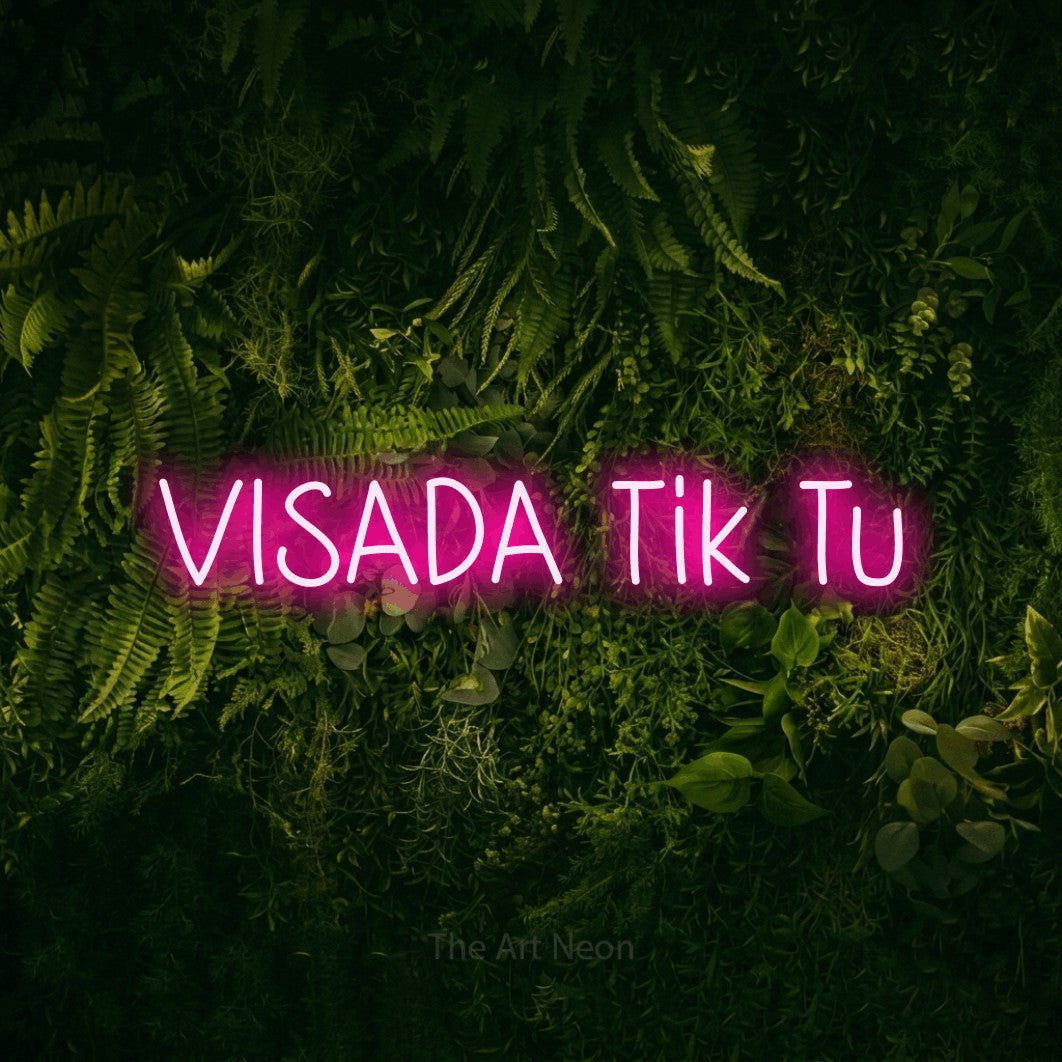 LED neon sign reading “VISADA Tik Tu”, arranged in a single line.