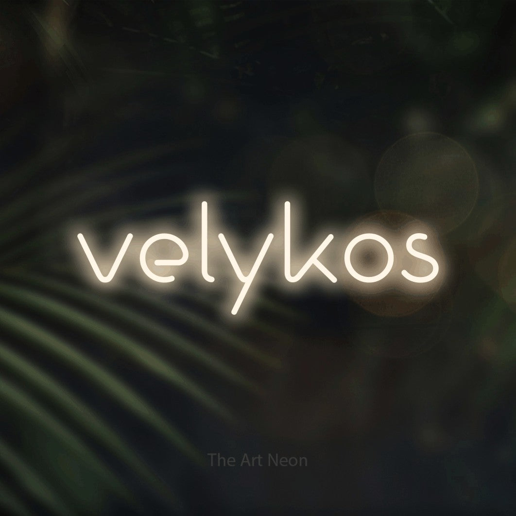 LED neon sign reading “velykos”, arranged in a single line.