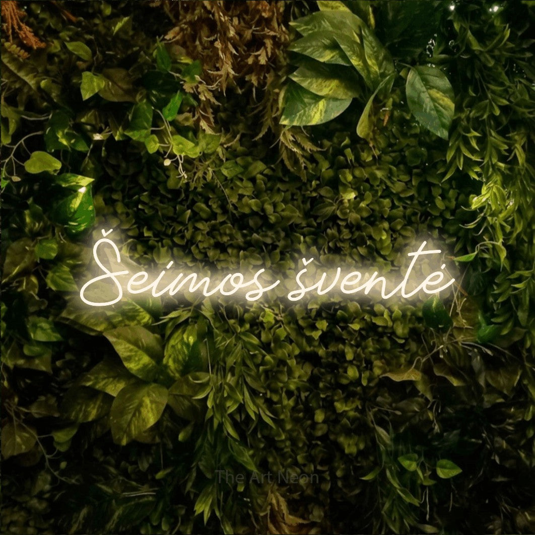 LED neon sign reading “Šeimos šventė”, arranged in a single line.