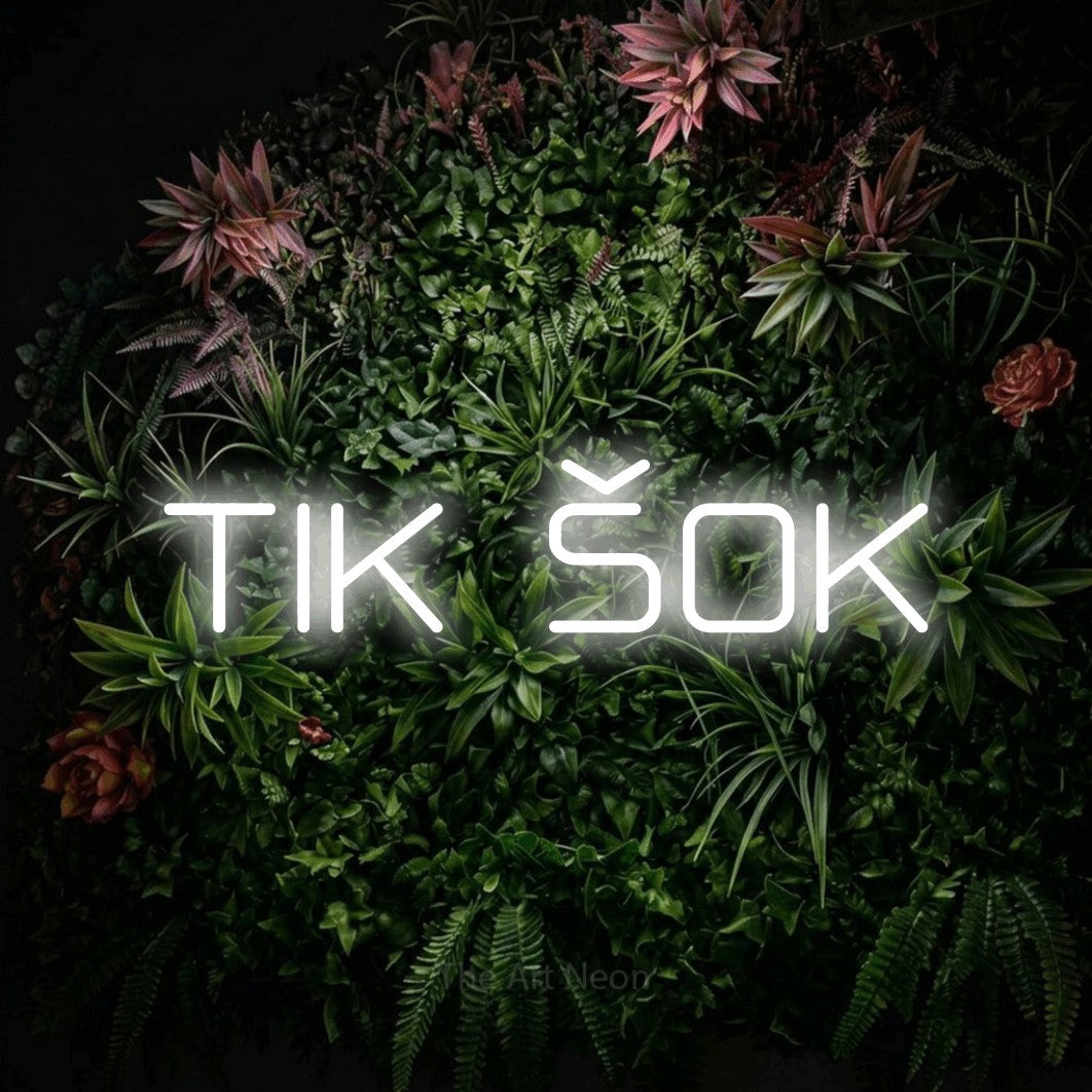 LED neon sign reading “TIK ŠOK”, arranged in a single line.