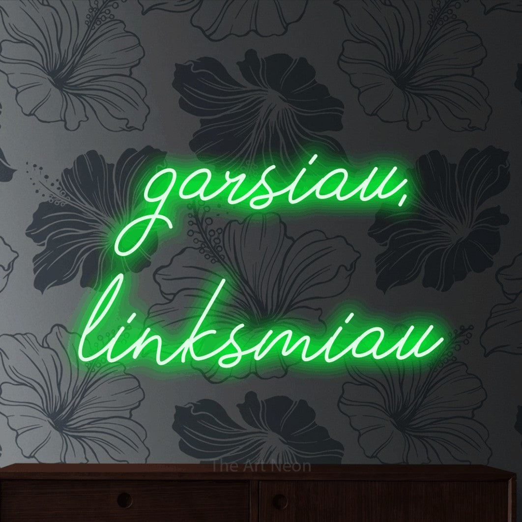 LED neon sign reading “garsiau, linksmiau”, arranged in two lines.