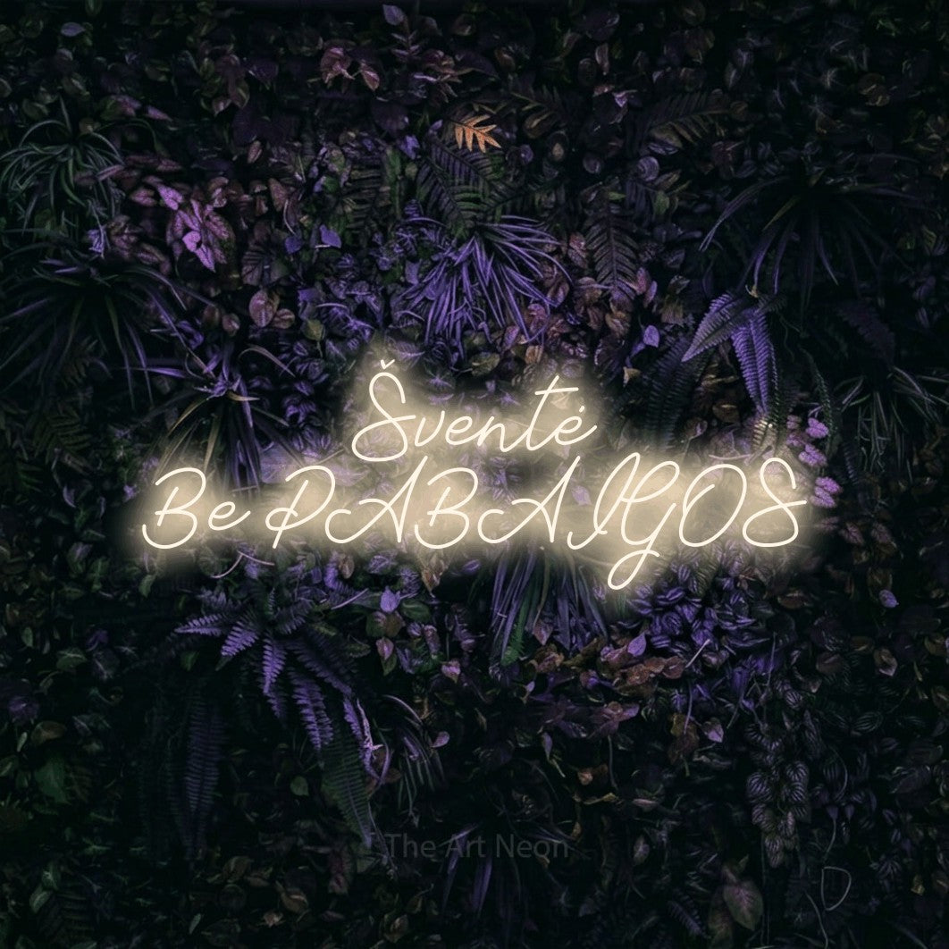 LED neon sign reading “Šventė Be PABAIGOS”, arranged in two lines.