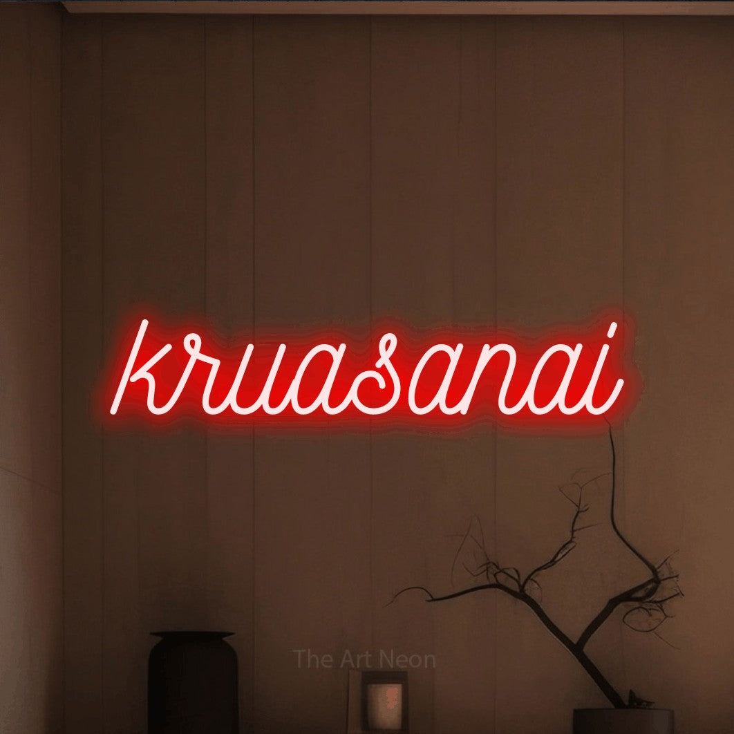 LED neon sign reading “kruasanai”, arranged in a single line.