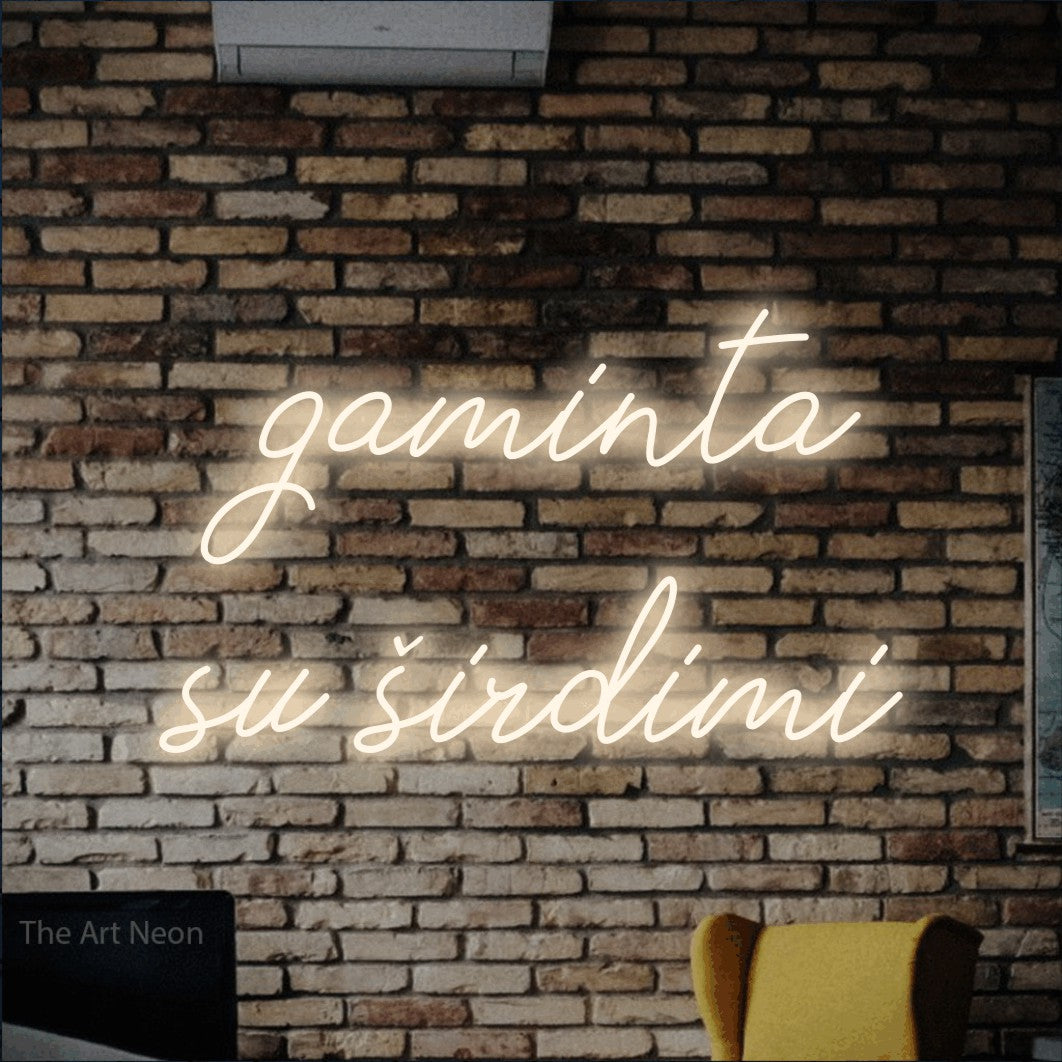 LED neon sign reading “gaminta su širdimi”, arranged in two lines.