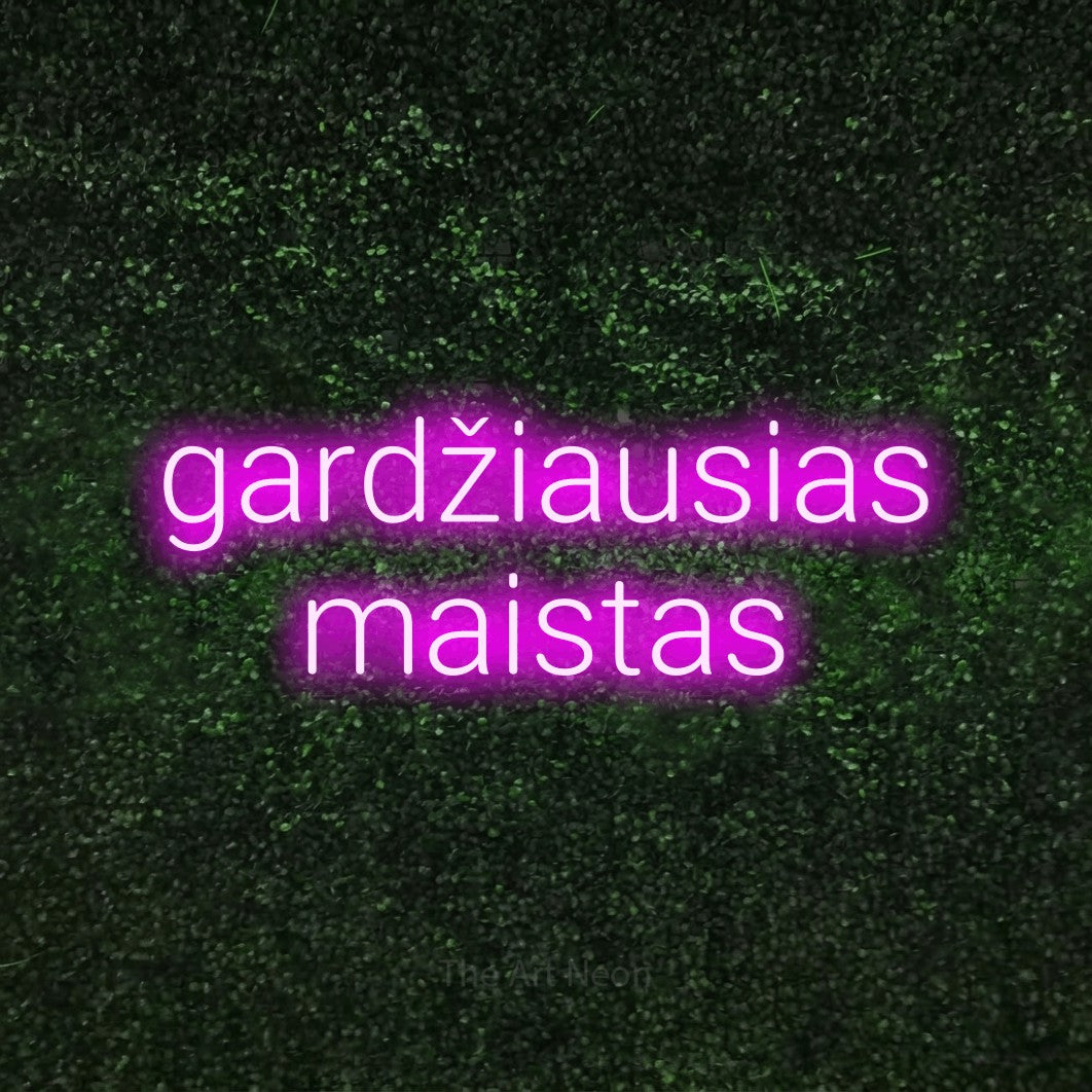 LED neon sign reading “gardžiausias maistas”, arranged in two lines.