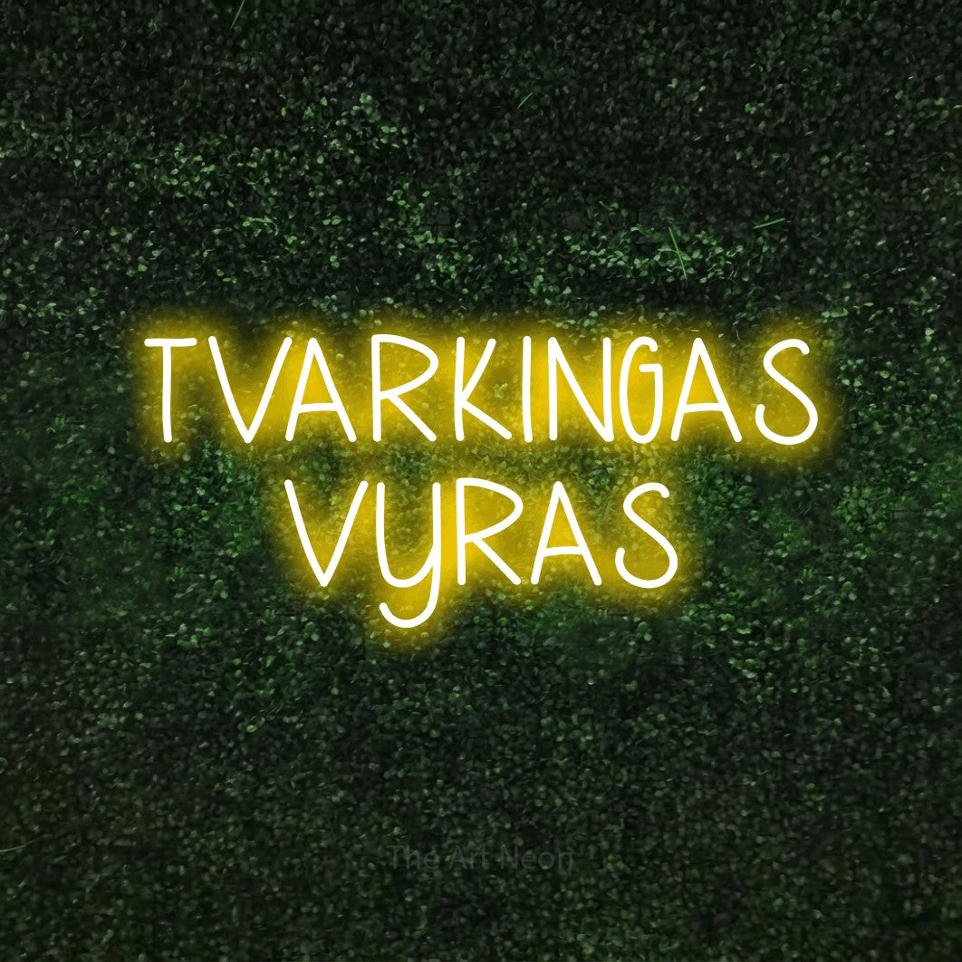 LED neon sign reading “TVARKINGAS VYRAS”, arranged in two lines.
