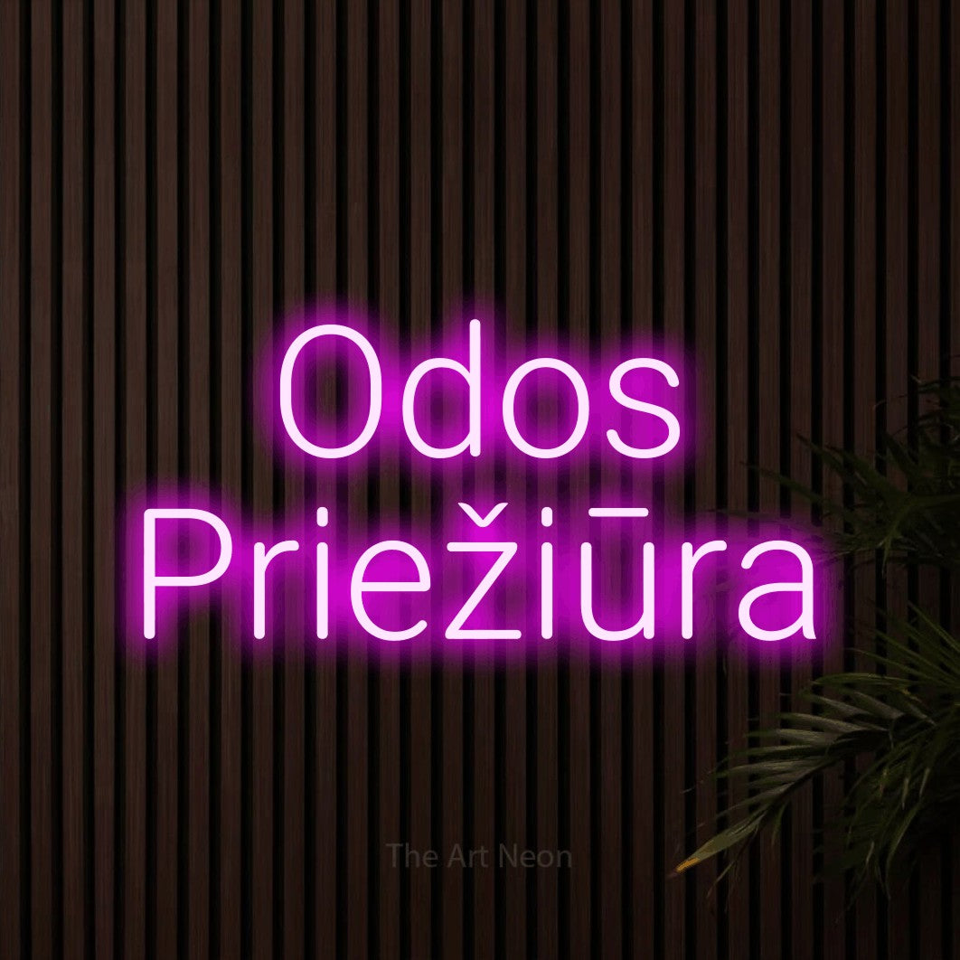 LED neon sign reading “Odos Priežiūra”, arranged in two lines.