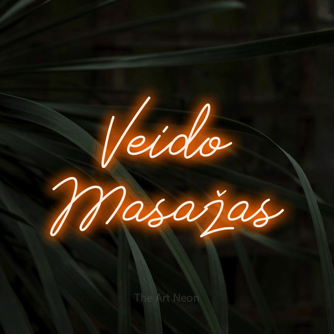 LED neon sign reading “Veido Masažas”, arranged in two lines.
