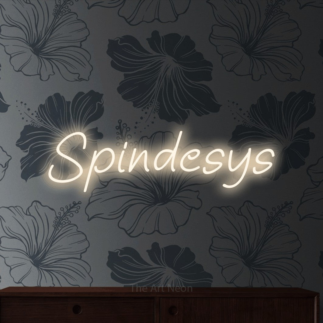LED neon sign reading “Spindesys”, arranged in a single line.