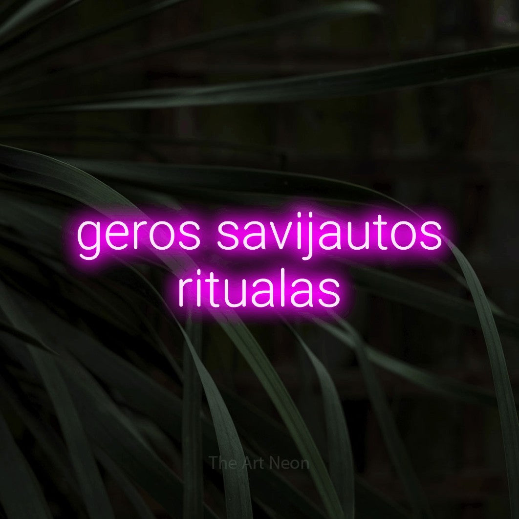 LED neon sign reading “geros savijautos ritualas”, arranged in two lines.