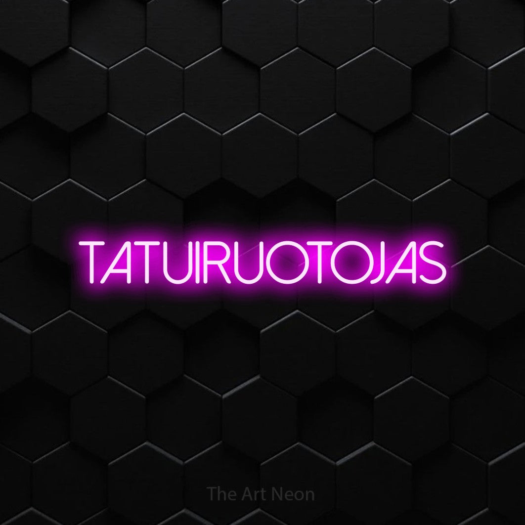 LED neon sign reading “TATUIRUOTOJAS”, arranged in a single line.