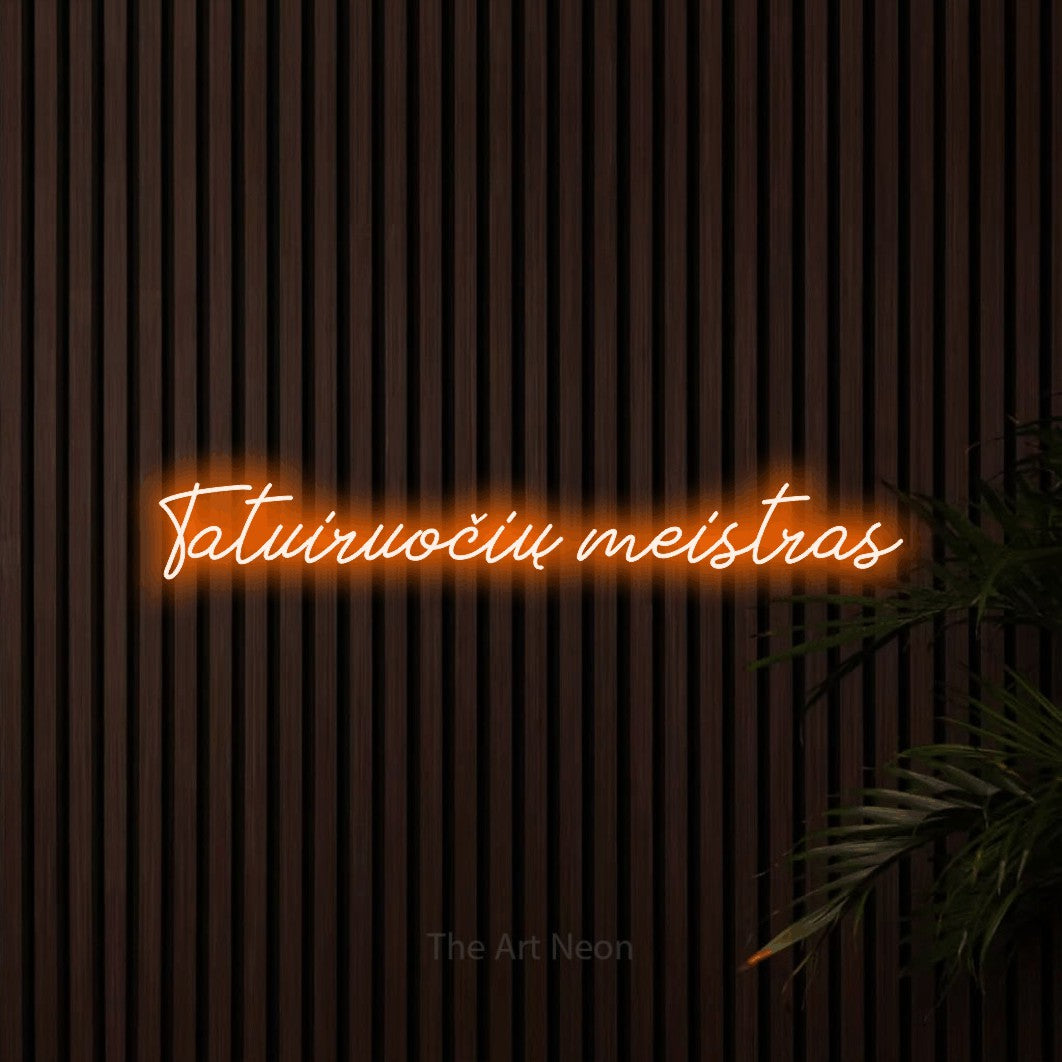 LED neon sign reading “Tatuiruočių meistras”, arranged in a single line.