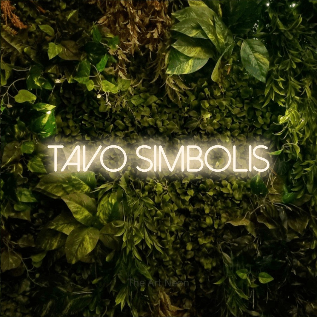 LED neon sign reading “Tavo Simbolis”, arranged in a single line.