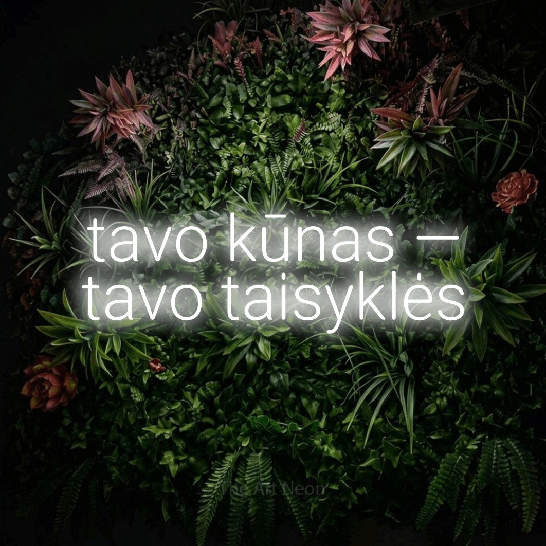 LED neon sign reading “tavo kūnas — tavo taisyklės”, arranged in two lines.
