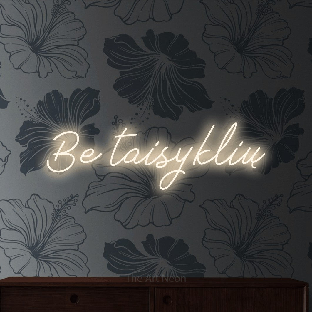 LED neon sign reading “Be taisyklių”, arranged in a single line.