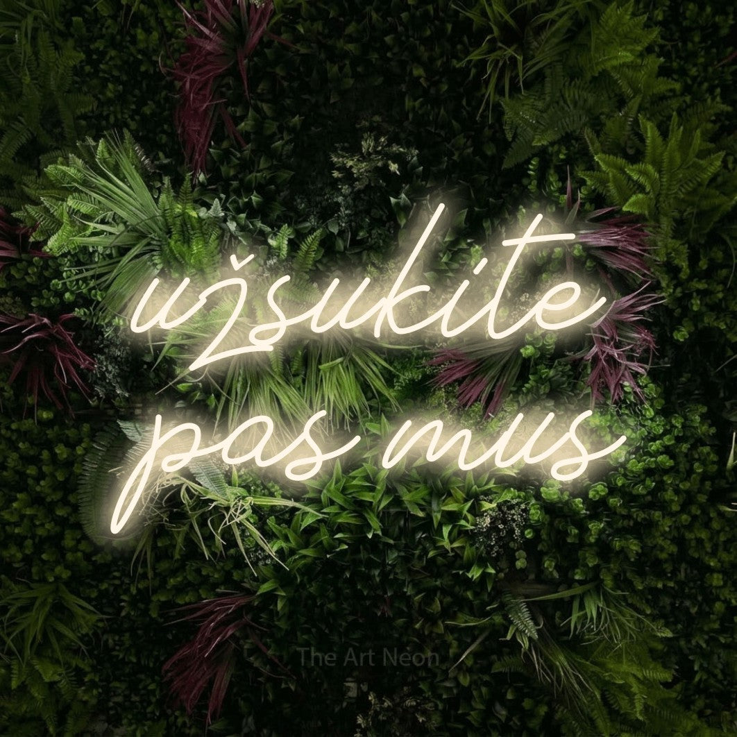 LED neon sign reading “užsukite pas mus”, arranged in two lines.