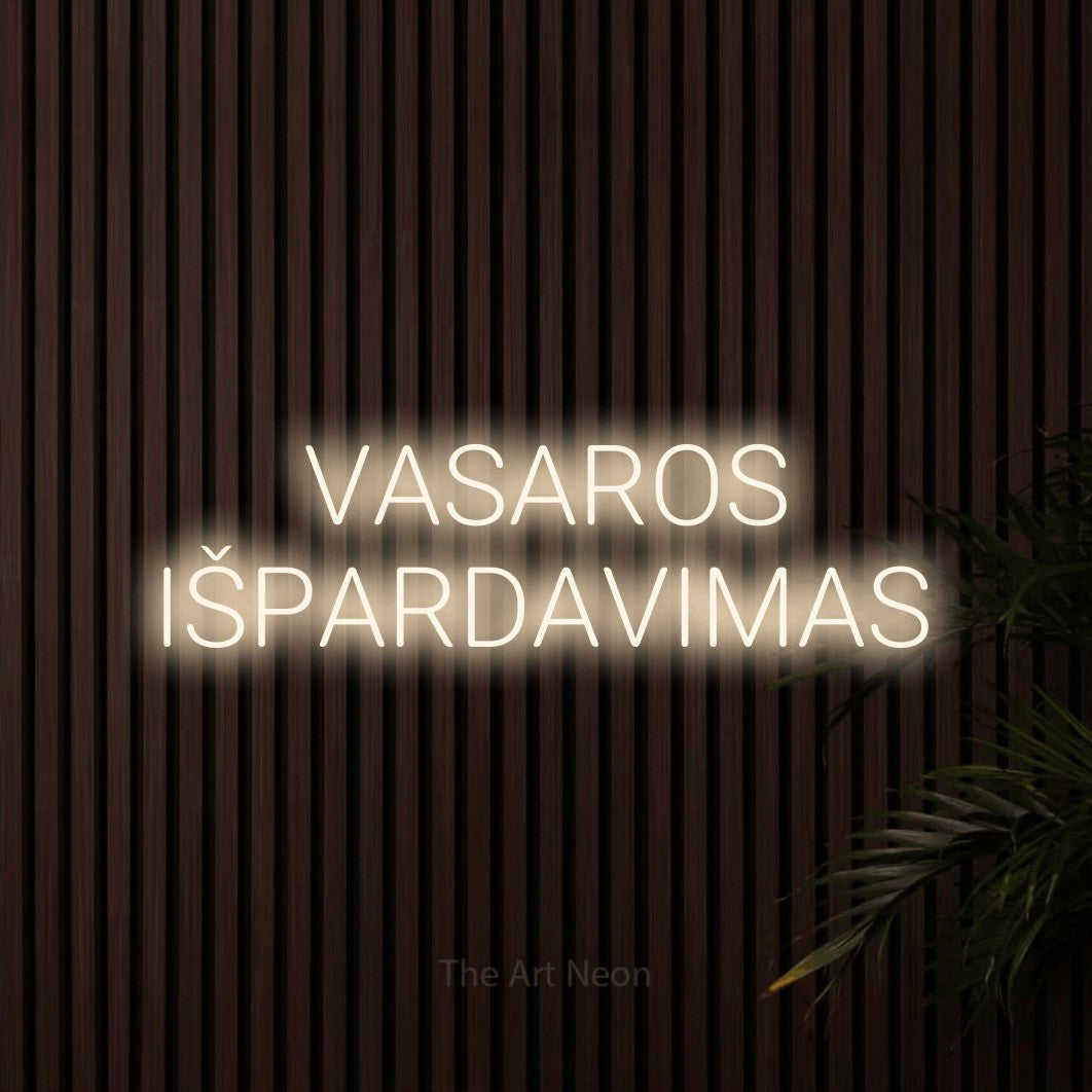 LED neon sign reading “VASAROS IŠPARDAVIMAS”, arranged in two lines.