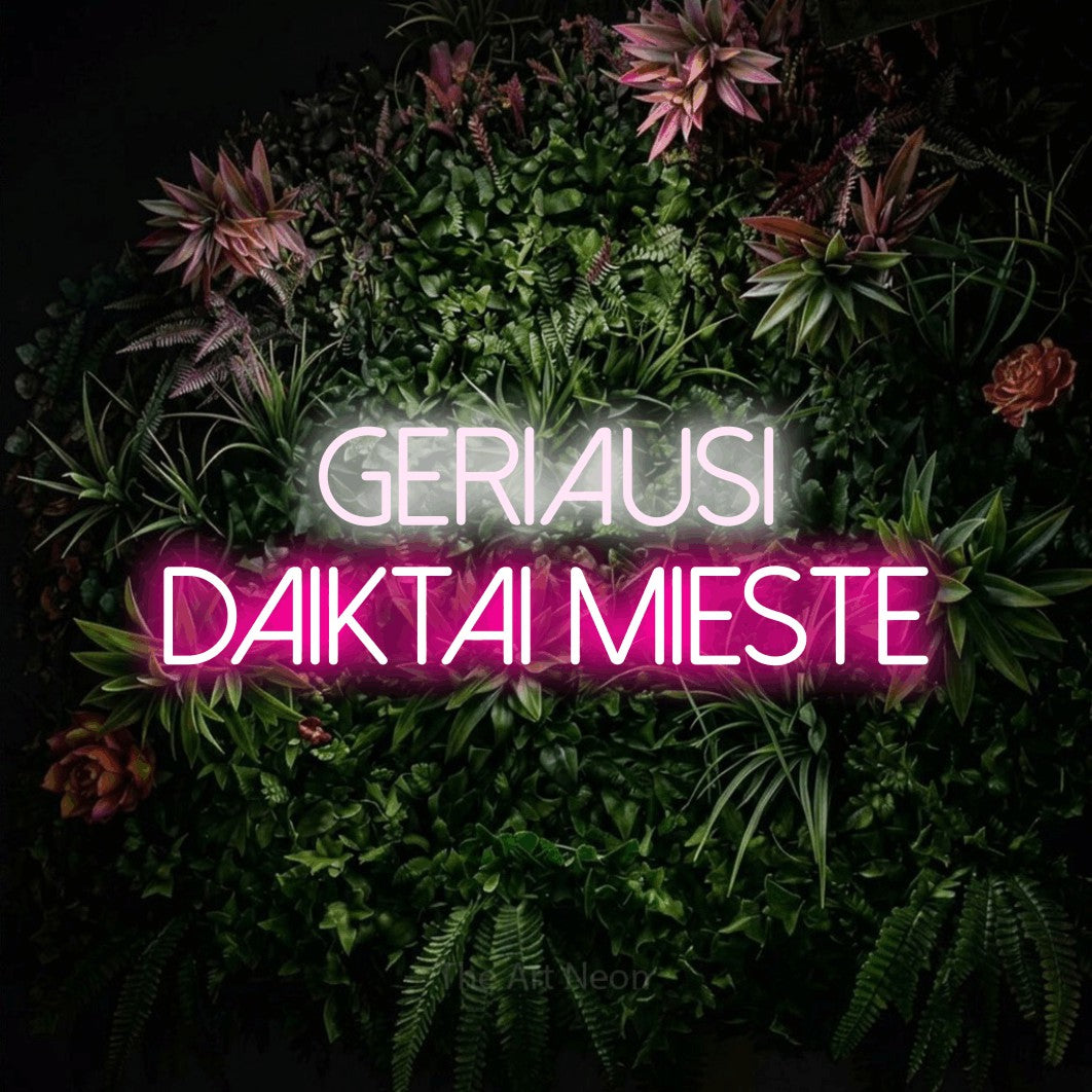 LED neon sign reading “Geriausi daiktai mieste”, arranged in two lines.