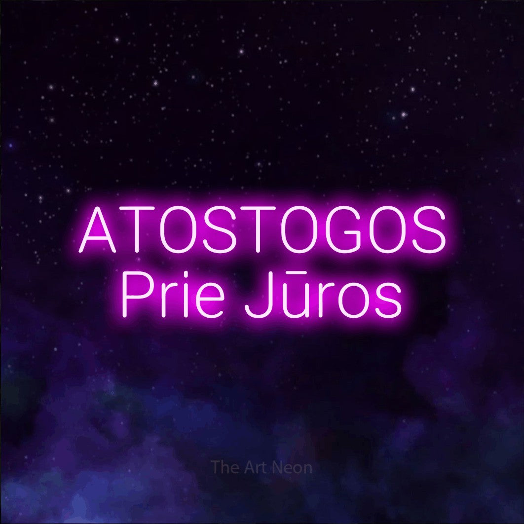 LED neon sign reading “ATOSTOGOS Prie Jūros”, arranged in two lines.
