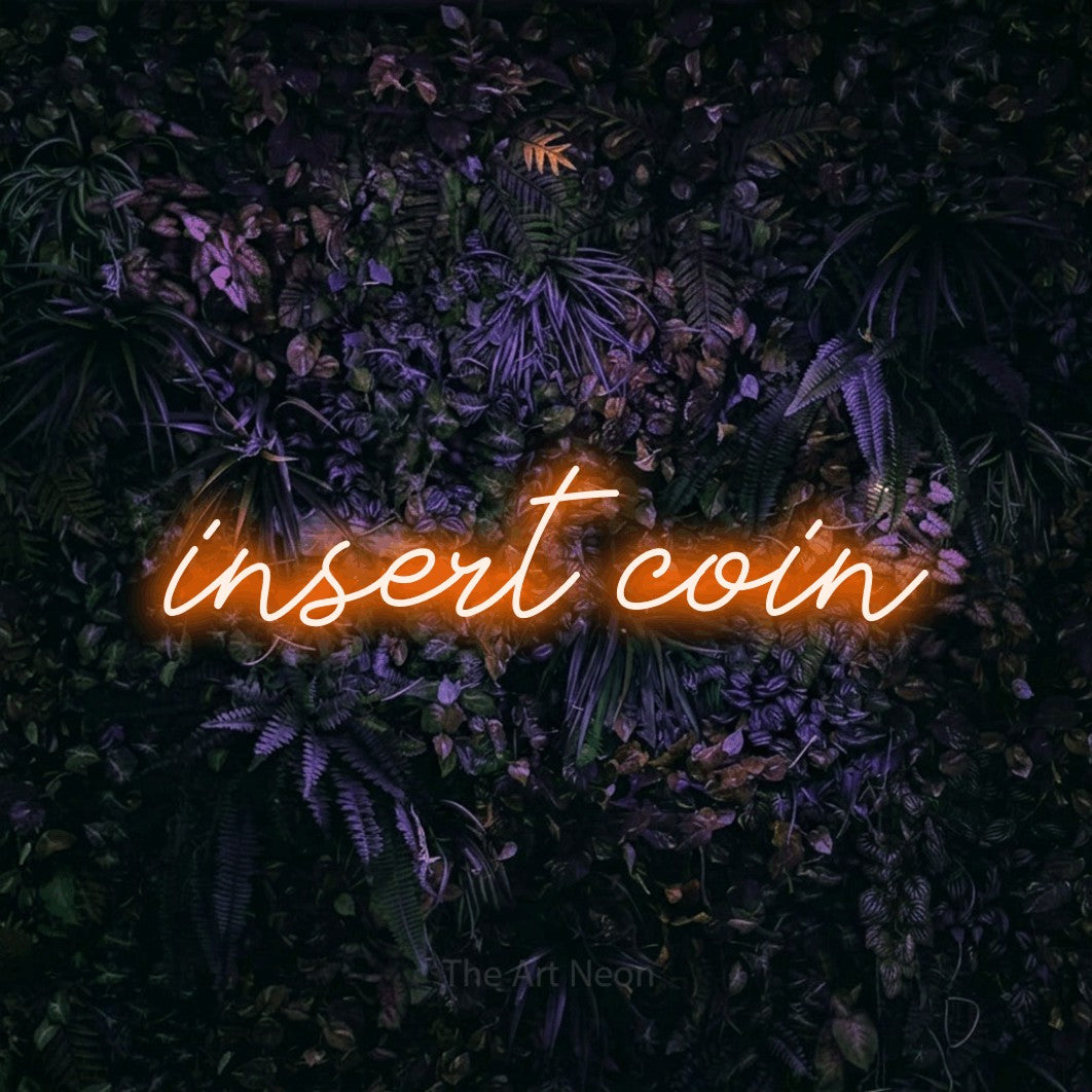 LED neon sign reading “insert coin”, arranged in a single line.