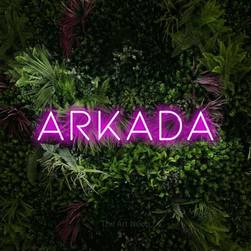 LED neon sign reading “ARKADA”, arranged in a single line.