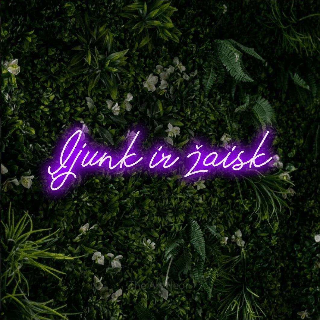 LED neon sign reading “Įjunk ir žaisk”, arranged in a single line.