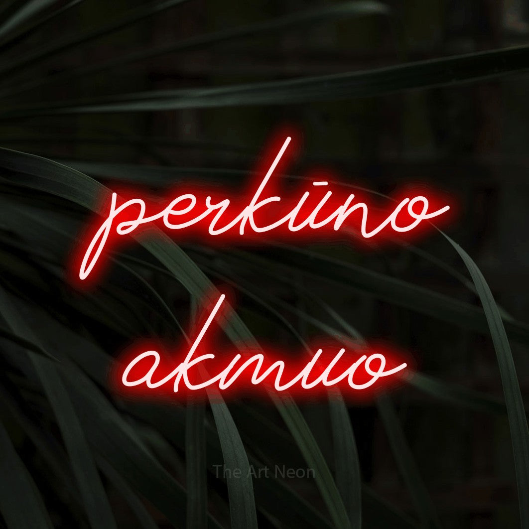 LED neon sign reading “perkūno akmuo”, arranged in two lines.