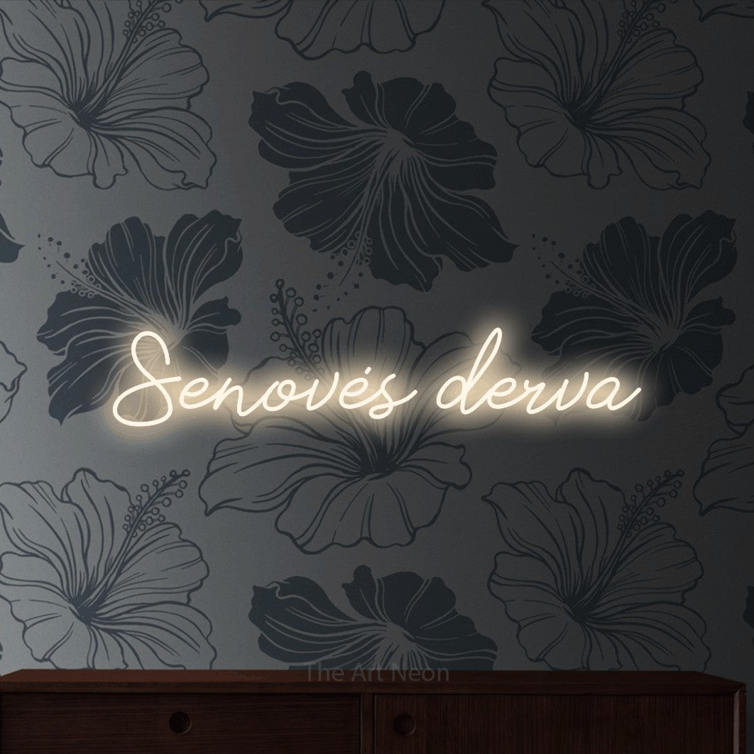 LED neon sign reading “Senovės derva”, arranged in a single line.