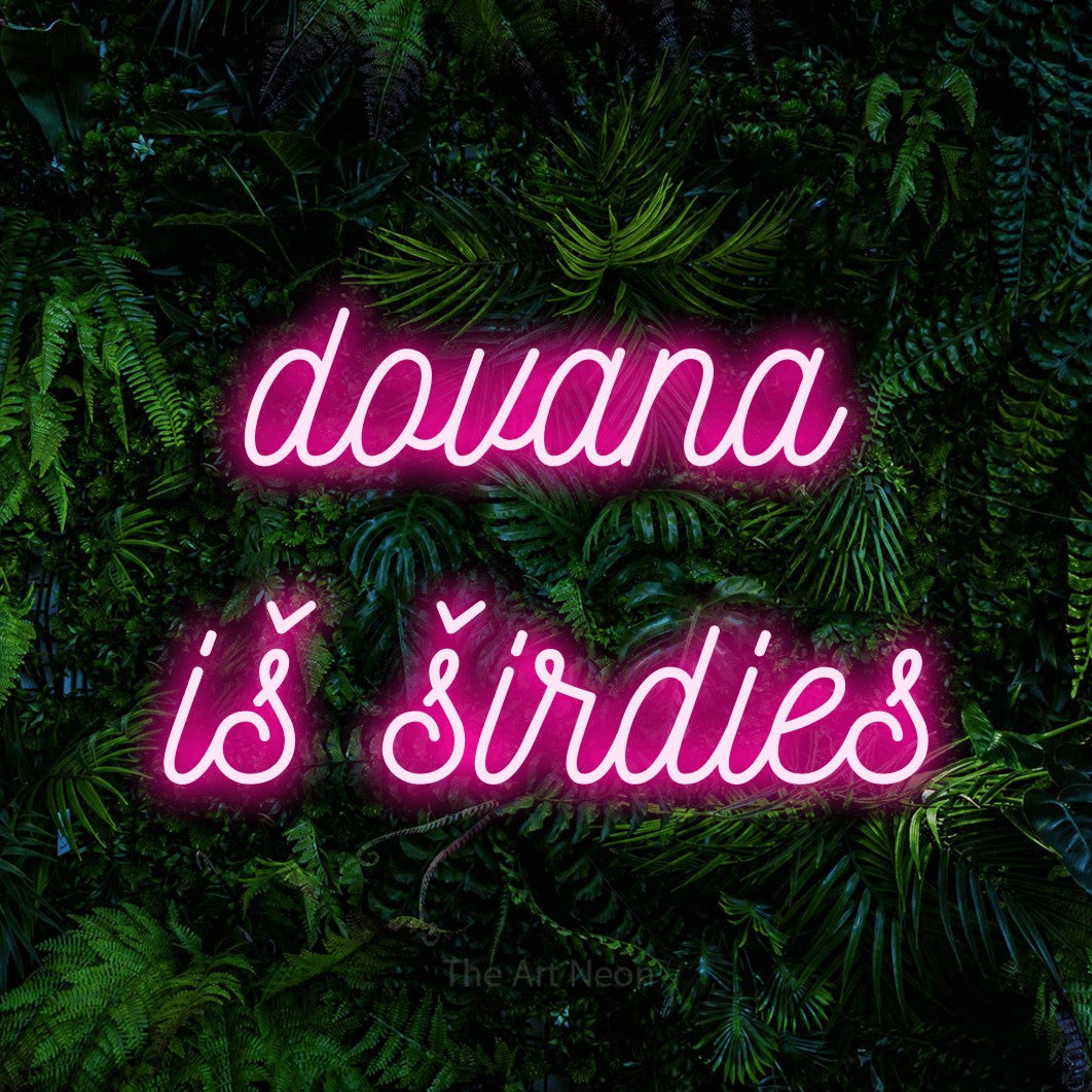 LED neon sign reading “dovana iš širdies”, arranged in two lines.