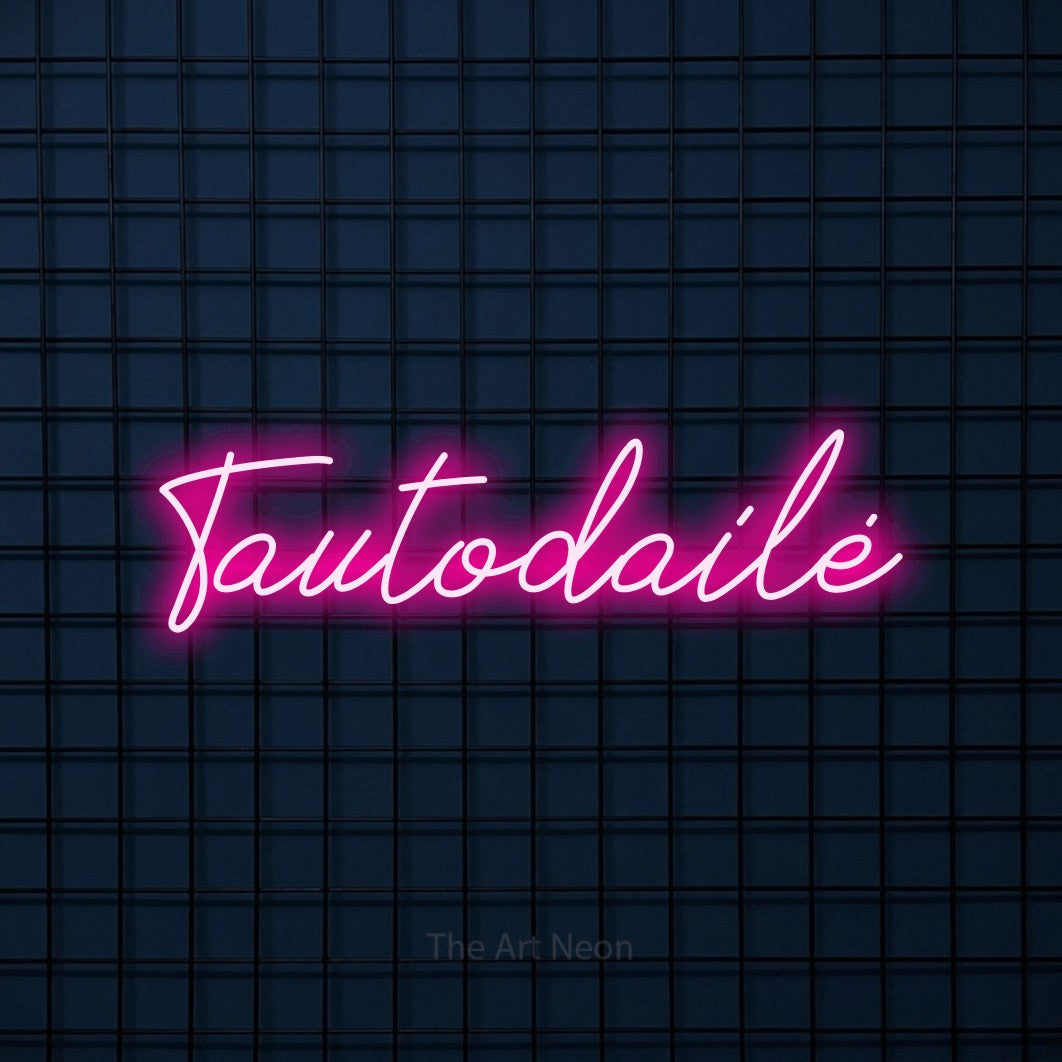 LED neon sign reading “Tautodailė”, arranged in a single line.