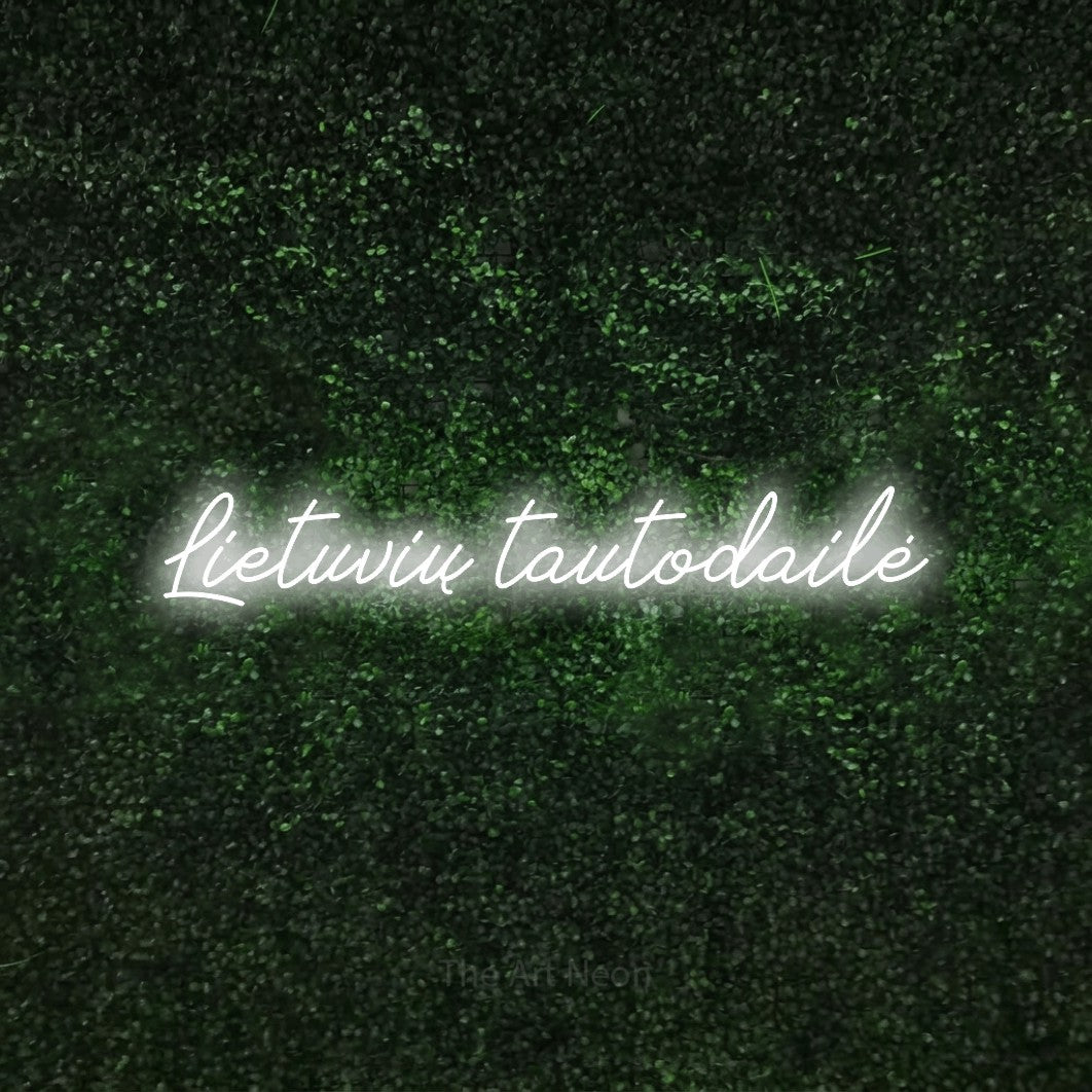 LED neon sign reading “Lietuvių tautodailė”, arranged in a single line.