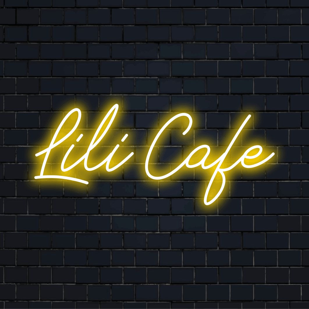 Lili Cafe Personalized LED Neon Sign, glowing wall decor against black brick wall