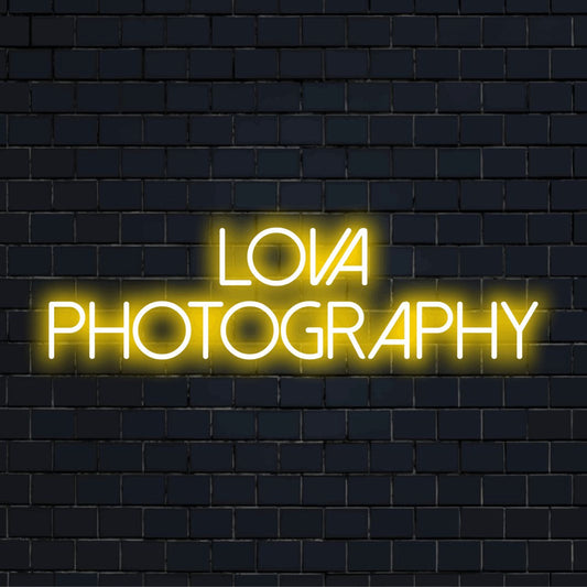 Lova Photography Personalized Neon Light with glowing neon text on dark brick wall