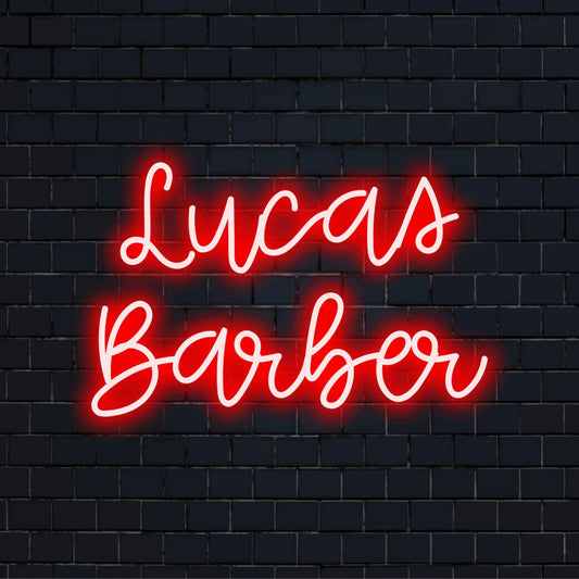 Lucas Barber Custom Name Neon Sign, glowing lettering on black brick background