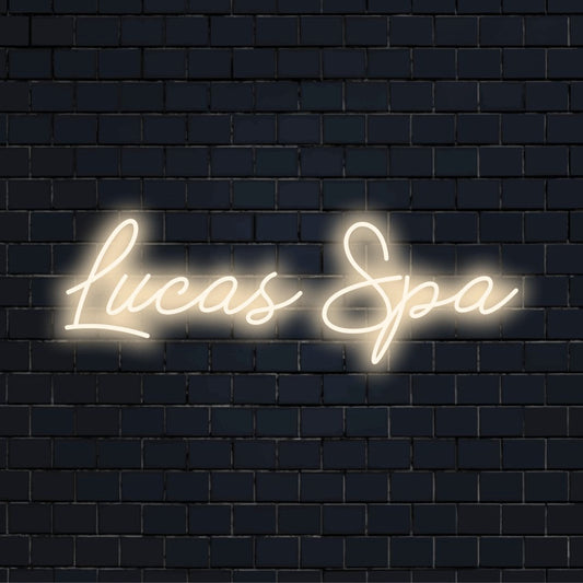Lucas Spa Personalized LED Neon Sign, bright neon glow on dark brick background