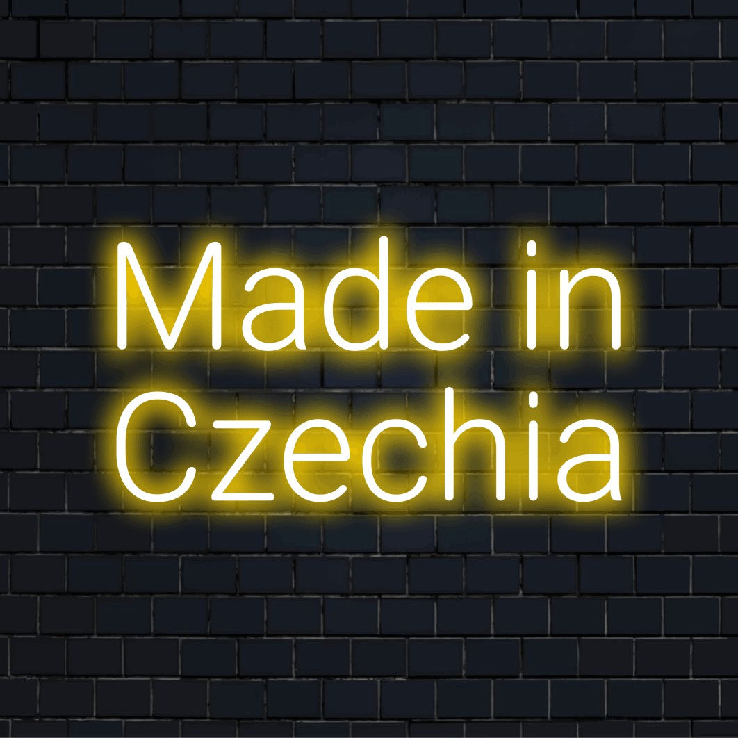 Made In Czechia Neon Light with glowing lettering on dark brick background