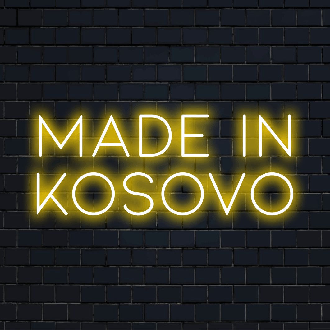 Made In Kosovo Neon Light with bright neon lettering against brick backdrop
