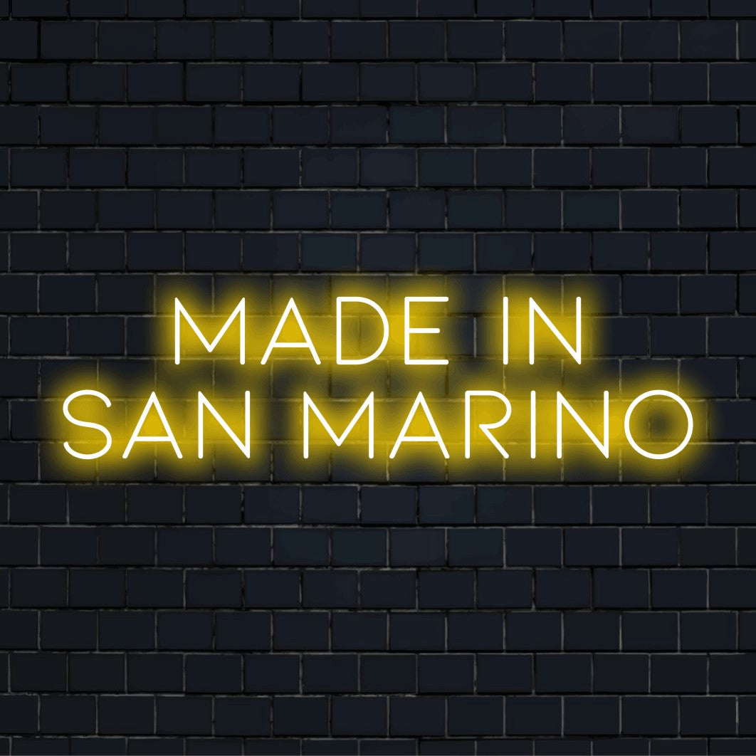 Made In San Marino Neon Light with glowing wall decor on dark brick background